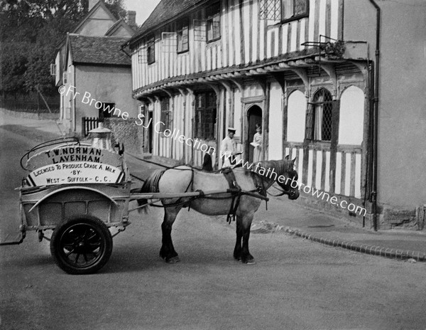 MILKMAN T W NORMAN IN OLD WORLD SETTING